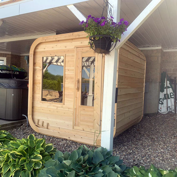 LeisureCraft CT Luna Sauna in a landscaped courtyard