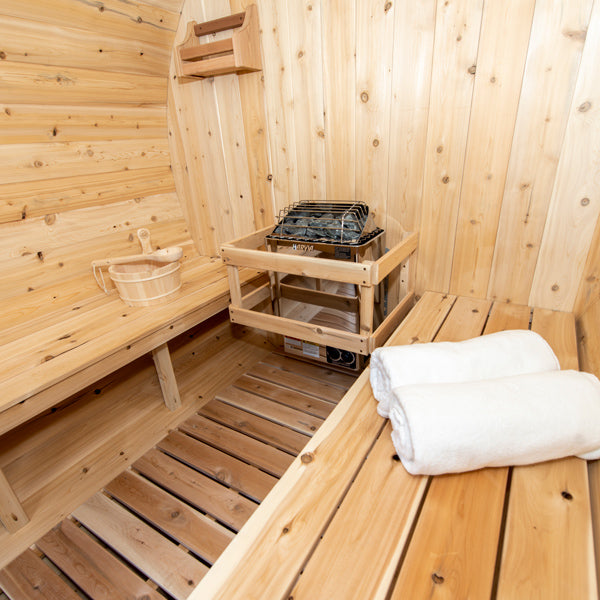 LeisureCraft CT Barrel Sauna interior, heater and bench detail
