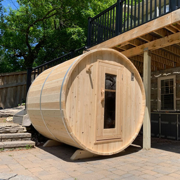 LeisureCraft CT Barrel Sauna, rear three-quarter view on a patio