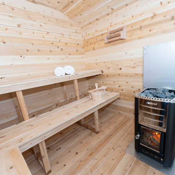 LeisureCraft CT Cabin Sauna interior with wood-burning heater